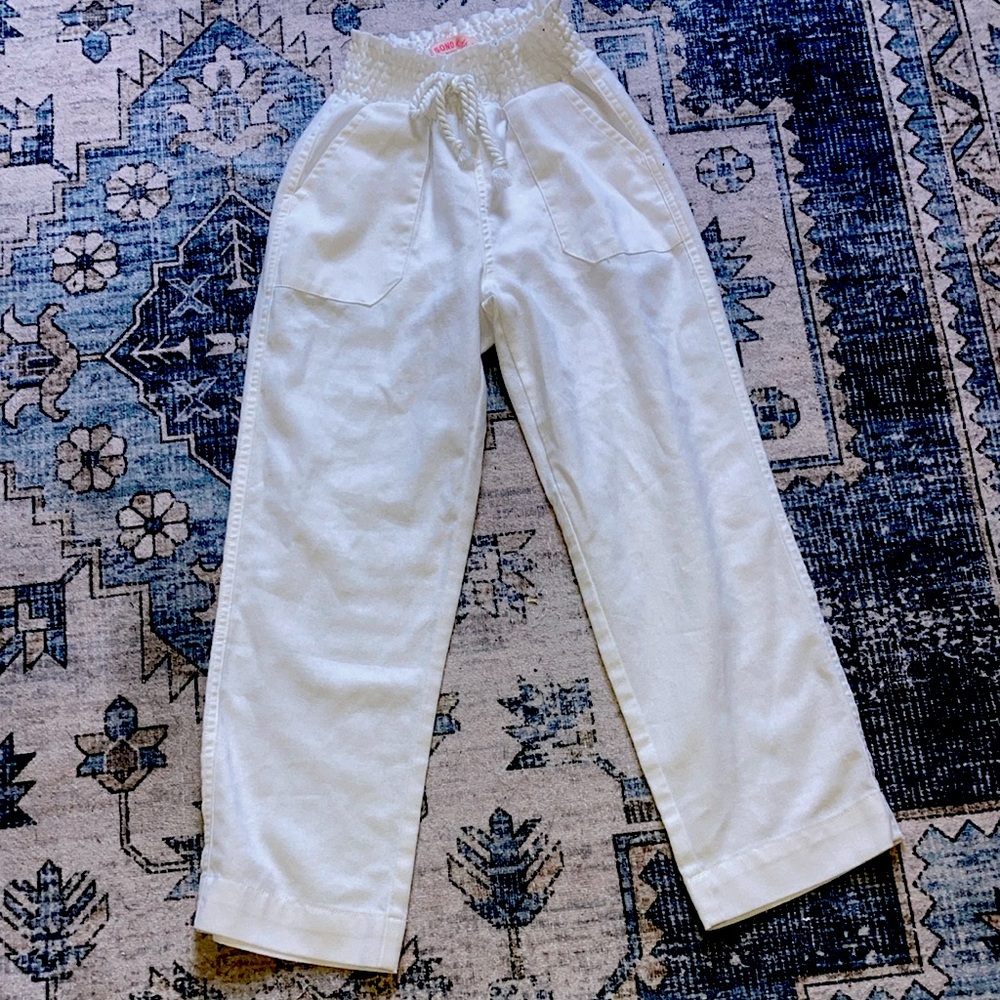 These are White baggy high waisted paper bag waist size 8 girls pants